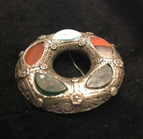 silver round brooch